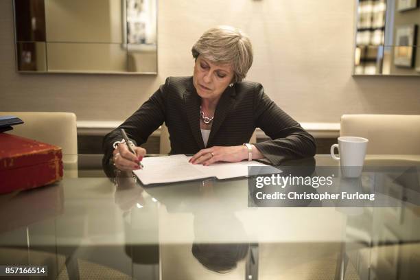 British Prime Minister Theresa May is pictured in her hotel room as she prepares her conference speech that she will deliver to her party's annual...