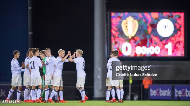 Players of Germany celebrate their win after the friendly match between Belgium U16 and Germany U16 on October 3, 2017 in Genk, Belgium.