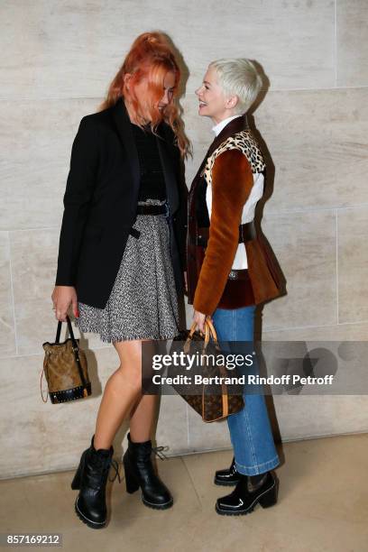 Busy Philipps and Michelle Williams attend the Louis Vuitton show as part of the Paris Fashion Week Womenswear Spring/Summer 2018 on October 3, 2017...