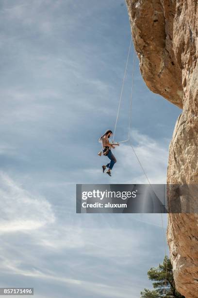 rock climber descending down in siurana catalonia - free falling stock pictures, royalty-free photos & images