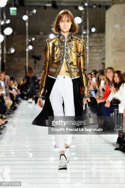 Model walks the runway during the Louis Vuitton Paris show as part of the Paris Fashion Week Womenswear Spring/Summer 2018 on October 3, 2017 in...