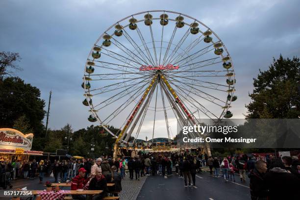 General view of an amusement area set up along 17th of June Street in Tiergraten Park near the Brandenburg Gate on German Unity Day on October 3,...