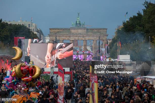 General view of an amusement area set up along 17th of June Street in Tiergraten Park near the Brandenburg Gate on German Unity Day on October 3,...