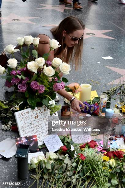 Flowers and notes are placed on the star of Tom Petty on behalf of the Hollywood community by the Hollywood Historic Trust on the Hollywood Walk of...