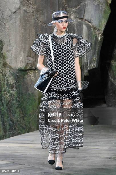 Michelle Gutknecht walks the runway during the Chanel Paris show as part of the Paris Fashion Week Womenswear Spring/Summer 2018 on October 3, 2017...