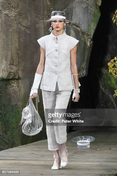 Justine Asset walks the runway during the Chanel Paris show as part of the Paris Fashion Week Womenswear Spring/Summer 2018 on October 3, 2017 in...