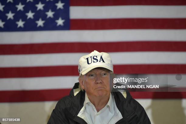 President Donald Trump and First Lady Melania Trump meet with US Virgin Islands Governor Kenneth Mapp in the Ward Room aboard the USS Kearsarge, off...