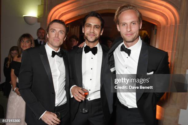 Guest, Luke Pasqualino and Jack Fox attend the BFI and IWC Luminous Gala at The Guildhall on October 3, 2017 in London, England.