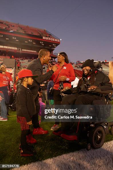 Ray Rice Rutguers Former Rutgers players Ray Rice and Eric LeGrand on field before game ...