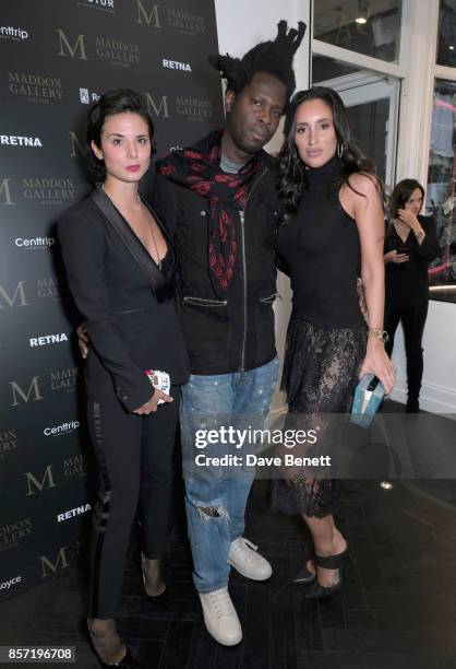 Stefania Arrivabene, Bradley Theodore and Lily Fortescue attends RETNA's Exhibition, supported by Ciroc, Victor Jet & Rolls Royce at the Maddox...