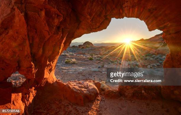 sunrise through redrock - nevada stock-fotos und bilder