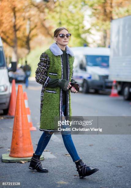 Olivia Palermo wearing green coat seen outside Moncler Gamme Rouge during Paris Fashion Week Spring/Summer 2018 on October 3, 2017 in Paris, France.