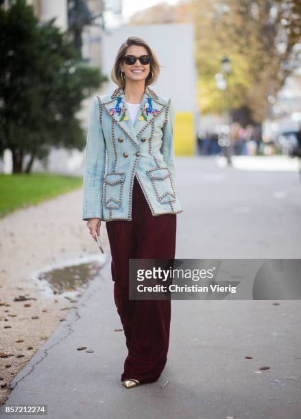 Helena Bordon wearing velvet pants, blazer jacket seen outside Moncler Gamme Rouge during Paris Fashion Week Spring/Summer 2018 on October 3, 2017 in...