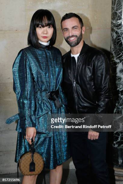 Actress Bae Doona and stylist Nicolas Ghesquiere pose after the Louis Vuitton show as part of the Paris Fashion Week Womenswear Spring/Summer 2018 on...