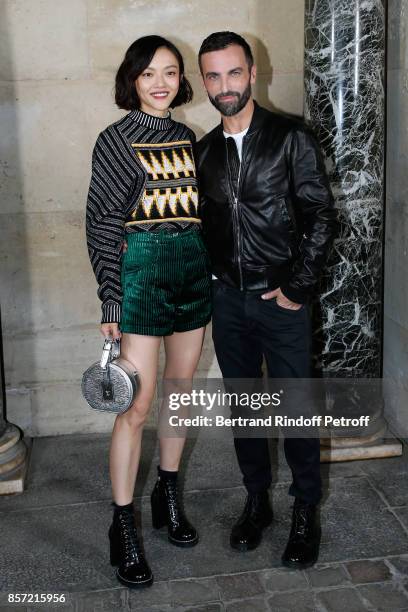 Model Rila Fukushima and stylist Nicolas Ghesquiere pose after the Louis Vuitton show as part of the Paris Fashion Week Womenswear Spring/Summer 2018...