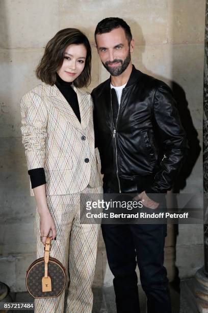 Janice Man and stylist Nicolas Ghesquiere pose after the Louis Vuitton show as part of the Paris Fashion Week Womenswear Spring/Summer 2018 on...