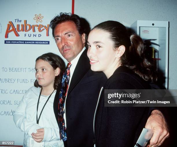 New York, NY. Armand Assante with his daguhters, Alesandra and Anya at the New York charity premiere of "Star Wars Episode 1: The Phantom Menace."...