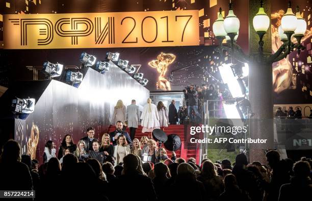 The cast members of different television series' arrive on the red carpet of the annual Russian television industry awards Tefi 2017 in Moscow on...