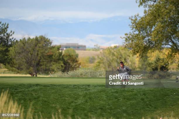 Calvin McCoy, of Regis Jesuit High School, lines up his putt during the 5A State Golf Championship at Common Grounds Golf Course on October 3, 2017...