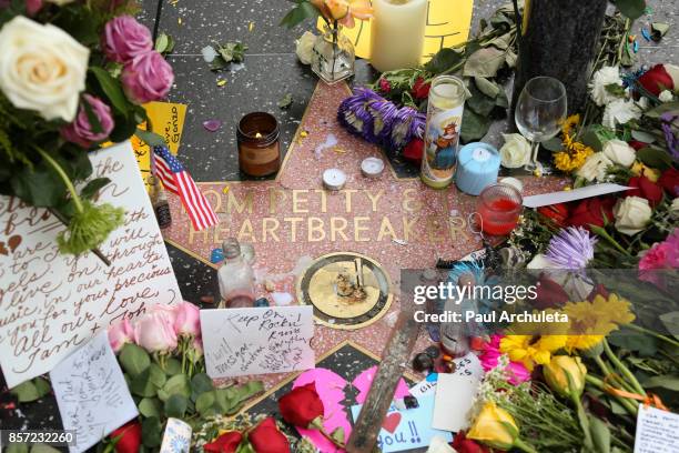 Flowers are placed on musician Tom Petty's star on The Hollywood Walk of Fame on October 3, 2017 in Hollywood, California. Petty died on October 2,...