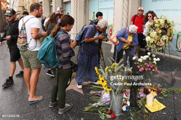 Flowers are placed on musician Tom Petty's star on The Hollywood Walk of Fame on October 3, 2017 in Hollywood, California. Petty died on October 2,...