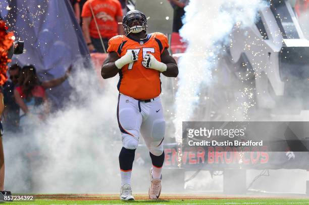 Offensive tackle Menelik Watson of the Denver Broncos runs onto the field during player introductions before a game against the Oakland Raiders at...