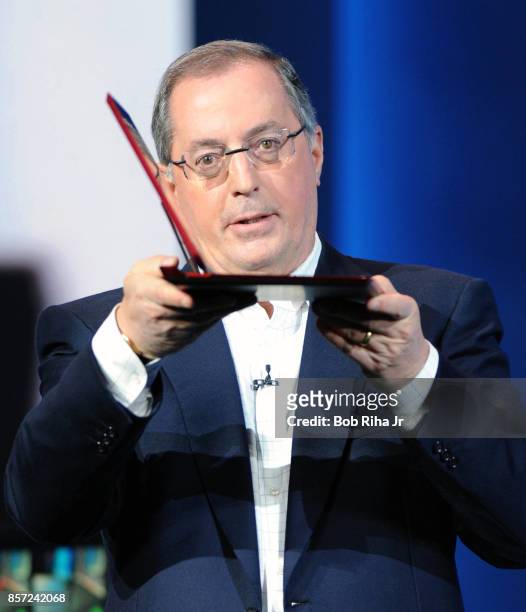 Intel president and ceo Paul Otellini shows the thinness of an Ultrabook device during the Intel keynote speech at the Consumer Electronic Show ,...