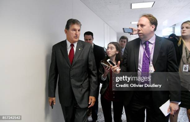Sen. Joe Manchin talks to reporters as he leaves a closed briefing of the Senate Intelligence Committee on October 3, 2017 in Washington, DC.