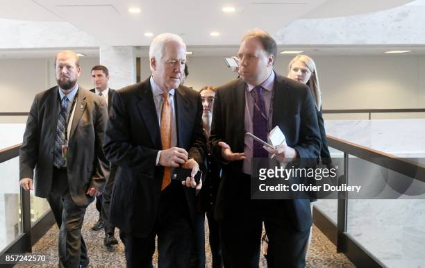 Sen. John Cornyn talks to reporters after leaving a closed briefing of the Senate Intelligence Committee on October 3, 2017 in Washington, DC.