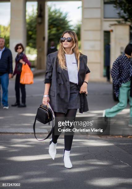 Miroslava Duma seen outside Miu Miu during Paris Fashion Week Spring/Summer 2018 on October 3, 2017 in Paris, France.