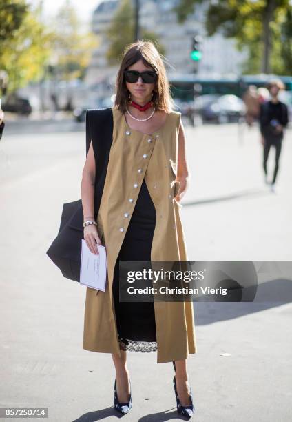 Natasha Goldenberg wearing sleeveless coat seen outside Thom Browne during Paris Fashion Week Spring/Summer 2018 on October 3, 2017 in Paris, France.