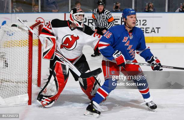 Sean Avery of the New York Rangers positions himself against goaltender Martin Brodeur of the New Jersey Devils on March 30, 2009 at Madison Square...