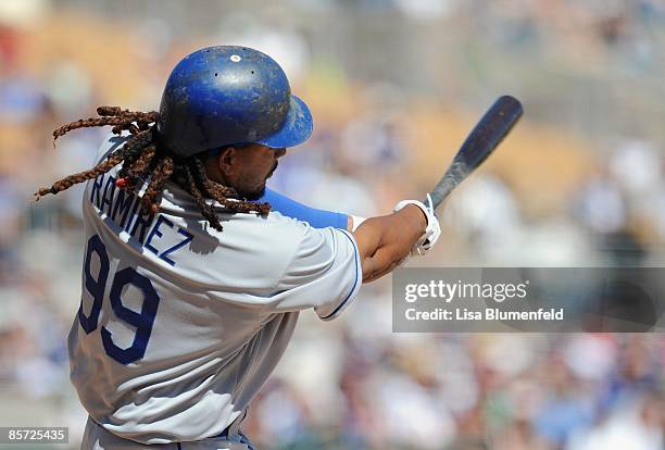 Manny Ramirez of the Los Angeles Dodgers hits a single during a Spring Training game against the Chicago White Sox at Camelback Ranch on March 28,...