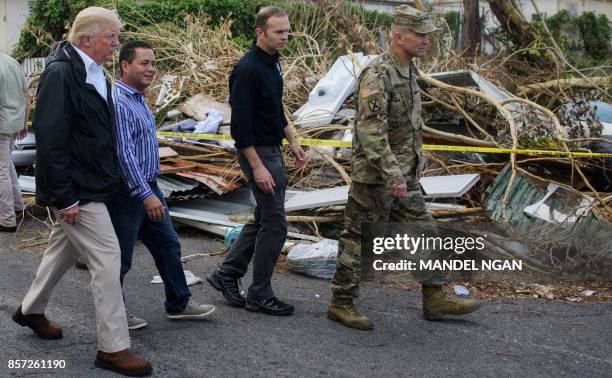 President Donald Trump visits residents affected by Hurricane in Guaynabo, west of San Juan, Puerto Rico on October 3, 2017. Nearly two weeks after...