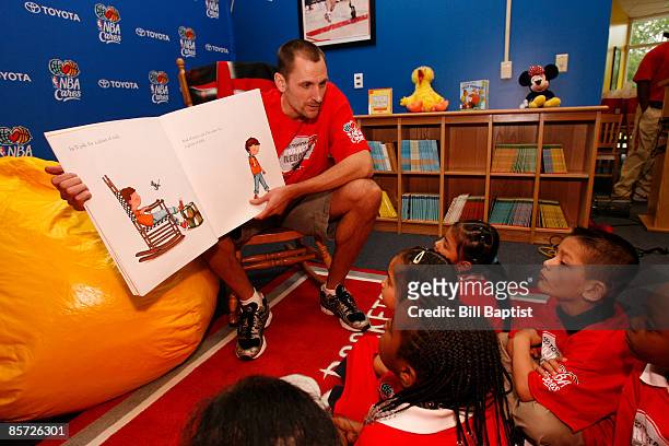 Houston Rockets player, Brent Barry talks to the students during a ceremony to open the new reading and learning center that was funded in...