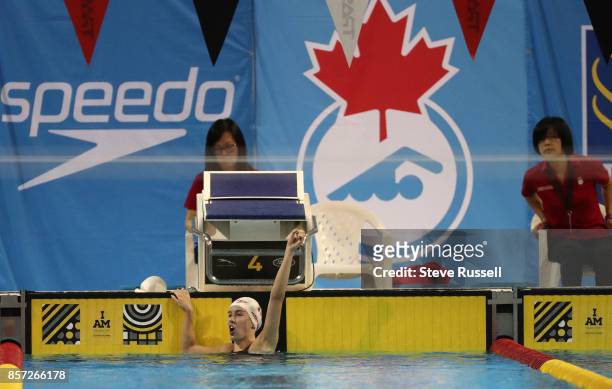 Justine Morrier of Canada celebrates after swimming the 100 metres breaststroke breaking the Canadian Record in the SB14 100-m breaststroke in...
