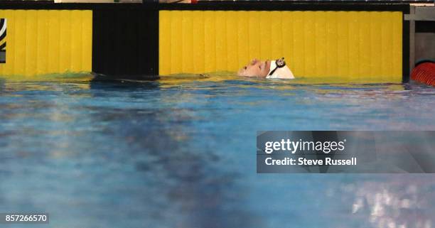 Shelby Newkirk of Canada rests after breaking the world record in the S7 100 metre backstroke in 1:21.43 as the Para-swimming athletes compete in the...