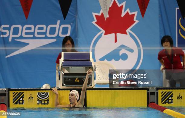 Justine Morrier of Canada celebrates after swimming the 100 metres breaststroke breaking the Canadian Record in the SB14 100-m breaststroke in...