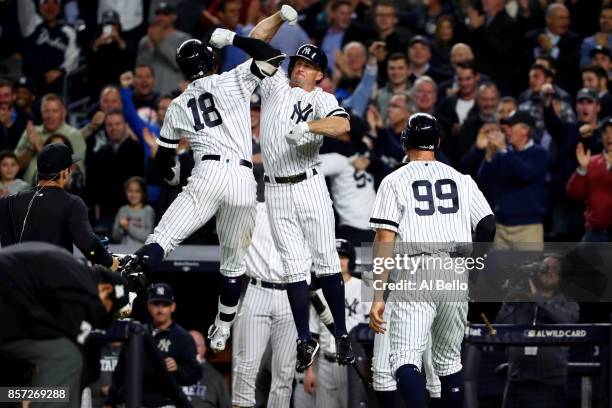 Didi Gregorius of the New York Yankees celebrates with Brett Gardner after hitting a three run home run against Ervin Santana of the Minnesota Twins...