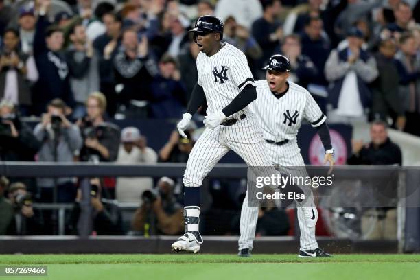 Didi Gregorius of the New York Yankees celebrates after hitting a three run home run against Ervin Santana of the Minnesota Twins during the first...