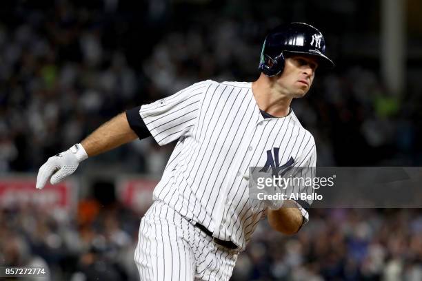 Brett Gardner of the New York Yankees rounds the bases after hitting a home run against Ervin Santana of the Minnesota Twins during the second inning...
