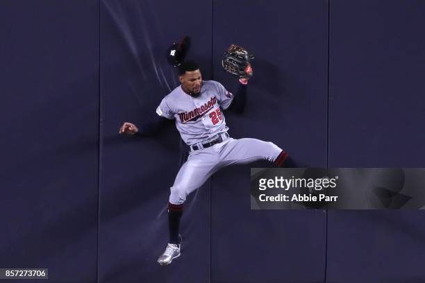 Byron Buxton of the Minnesota Twins hits the wall as he catches a pop up fly against the New York Yankees during the second inning in the American...