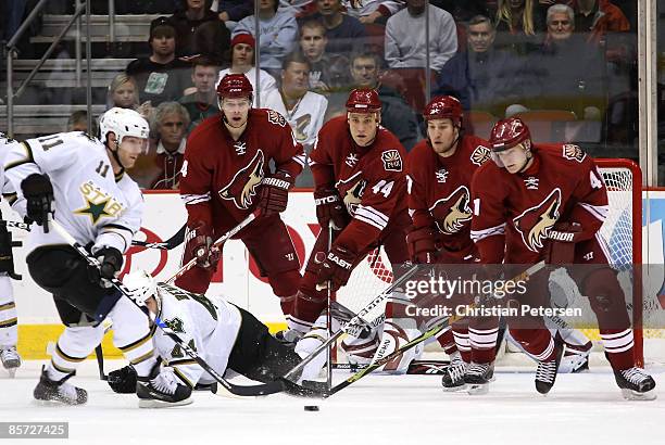 Zbynek Michalek, Kurt Sauer, Brandon Prust and Viktor Tikhonov of the Phoenix Coyotes defend against Brendan Morrison of the Dallas Stars during the...