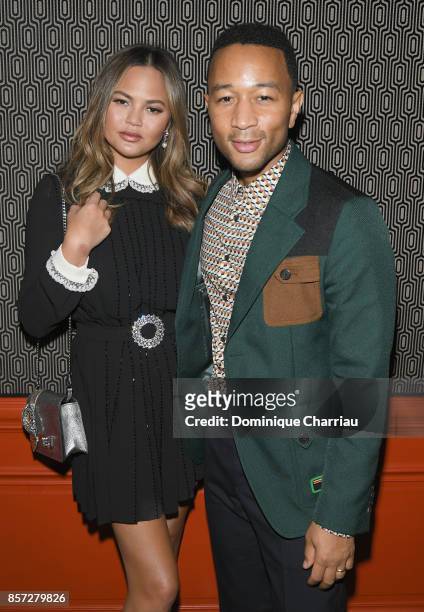 Chrissy Teigen and John Legend attend the Miu Miu aftershow party as part of the Paris Fashion Week Womenswear Spring/Summer 2018 at Boum Boum on...