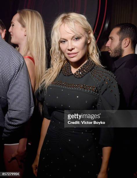 Pamela Anderson attends the Miu Miu aftershow party as part of the Paris Fashion Week Womenswear Spring/Summer 2018 at Boum Boum on October 3, 2017...