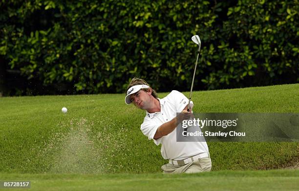 Mitchell Brown of Australia hits out from the sand on the 13th hole during Day One of The Open International Final Qualifying for Asia held on March...