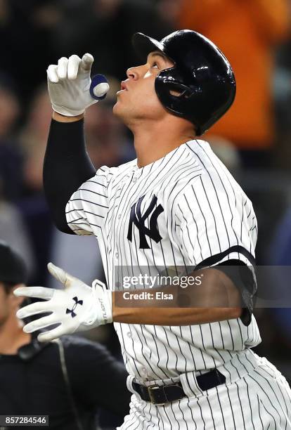 Aaron Judge of the New York Yankees rounds the bases after hitting a two run home run against Jose Berrios of the Minnesota Twins during the fourth...