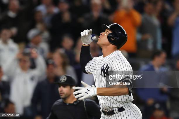 Aaron Judge of the New York Yankees rounds the bases after hitting a two run home run against Jose Berrios of the Minnesota Twins during the fourth...