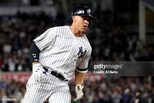 Aaron Judge of the New York Yankees rounds the bases after hitting a two run home run against Jose Berrios of the Minnesota Twins during the fourth...