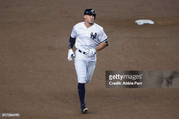 Aaron Judge of the New York Yankees rounds the bases after hitting a two run home run against Jose Berrios of the Minnesota Twins during the fourth...